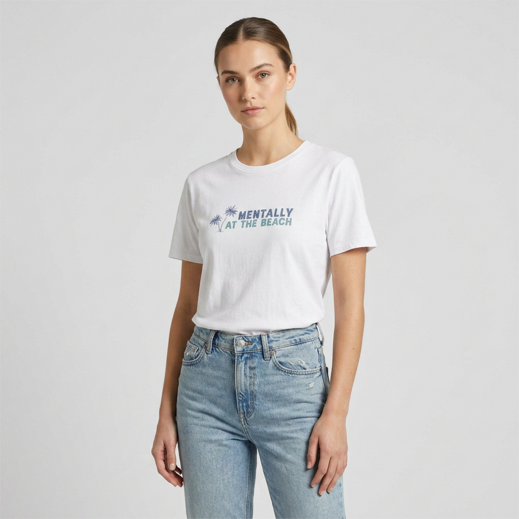 Person wearing a white t-shirt with text and light blue jeans on a plain background