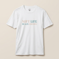 White t-shirt with 'Soft Life Beach Edition' text on a beige background